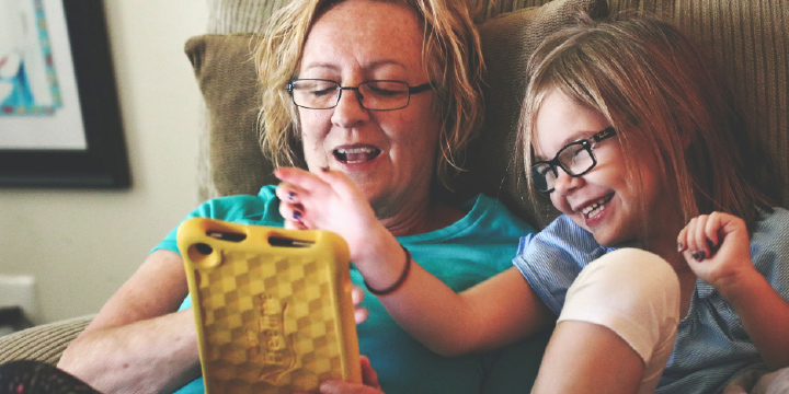 image of a woman and a child reading an ebook