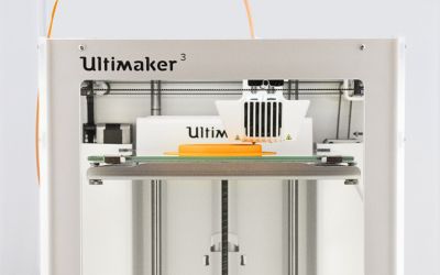 Ultimaker 3D Printer printing a yellow object.