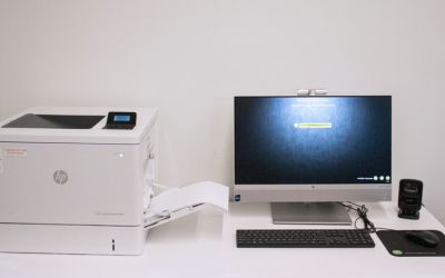 Printer set up next to a computer.