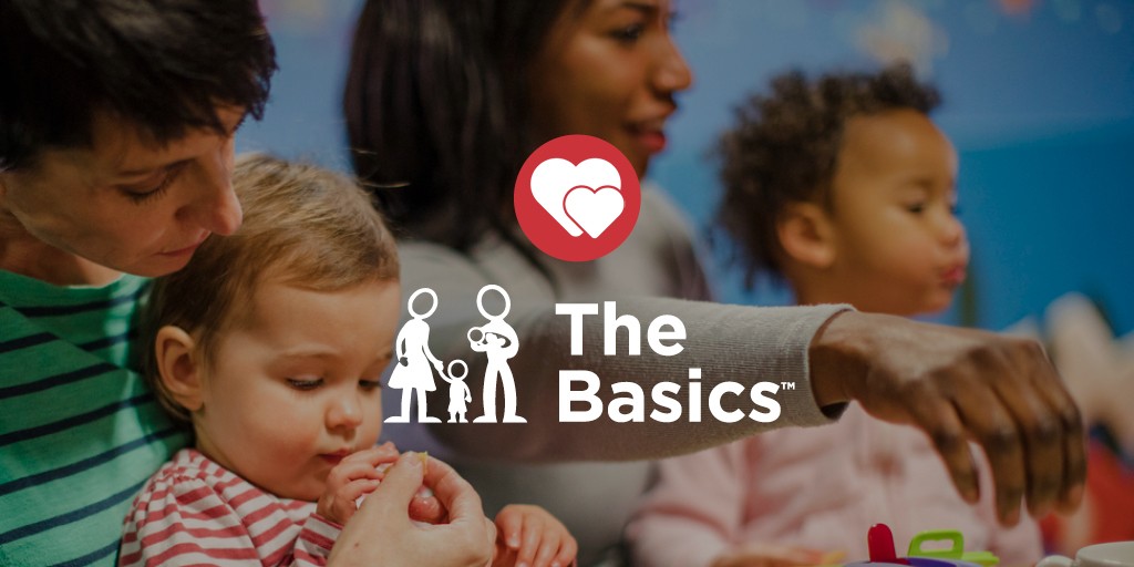 a blurred photo of two caregivers holding young toddlers with the logo for The Basics on top