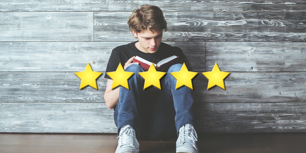 A teen sitting on the ground with their back against a shiplap wall is engrossed in a book. Five yellow stars are across the image. 
