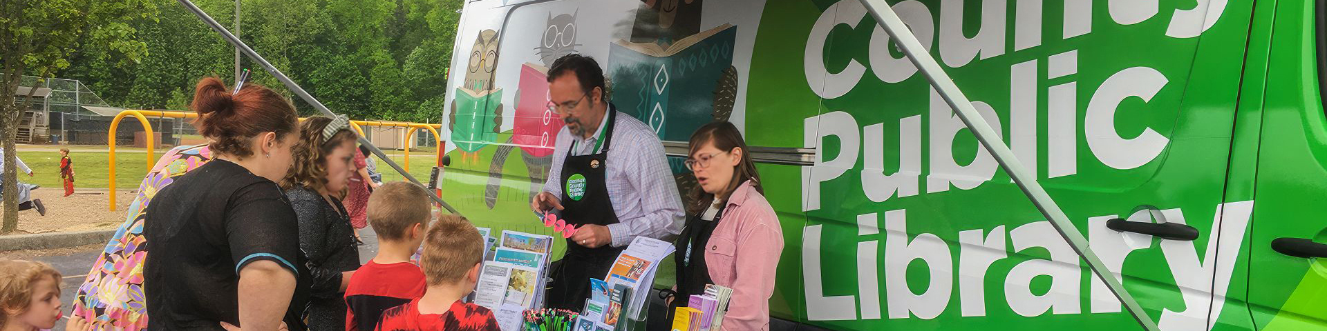 image of people visiting the Mobile Library Services van