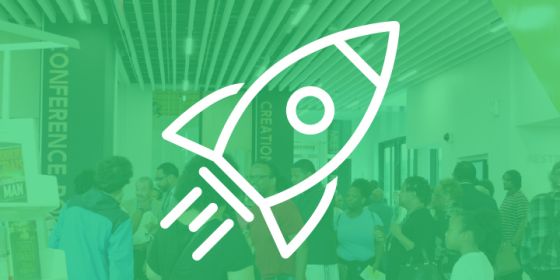 Illustrated Rocket overlaying a photo of people at a conference